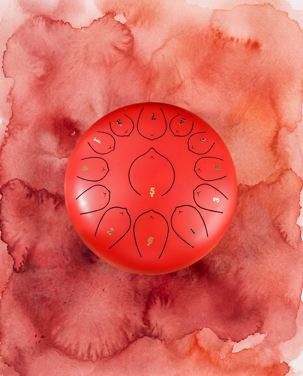 `Cinnabar Red Ethereal 12-inch steel tongue drum with numbered notes beneath an ethereal water color sky.