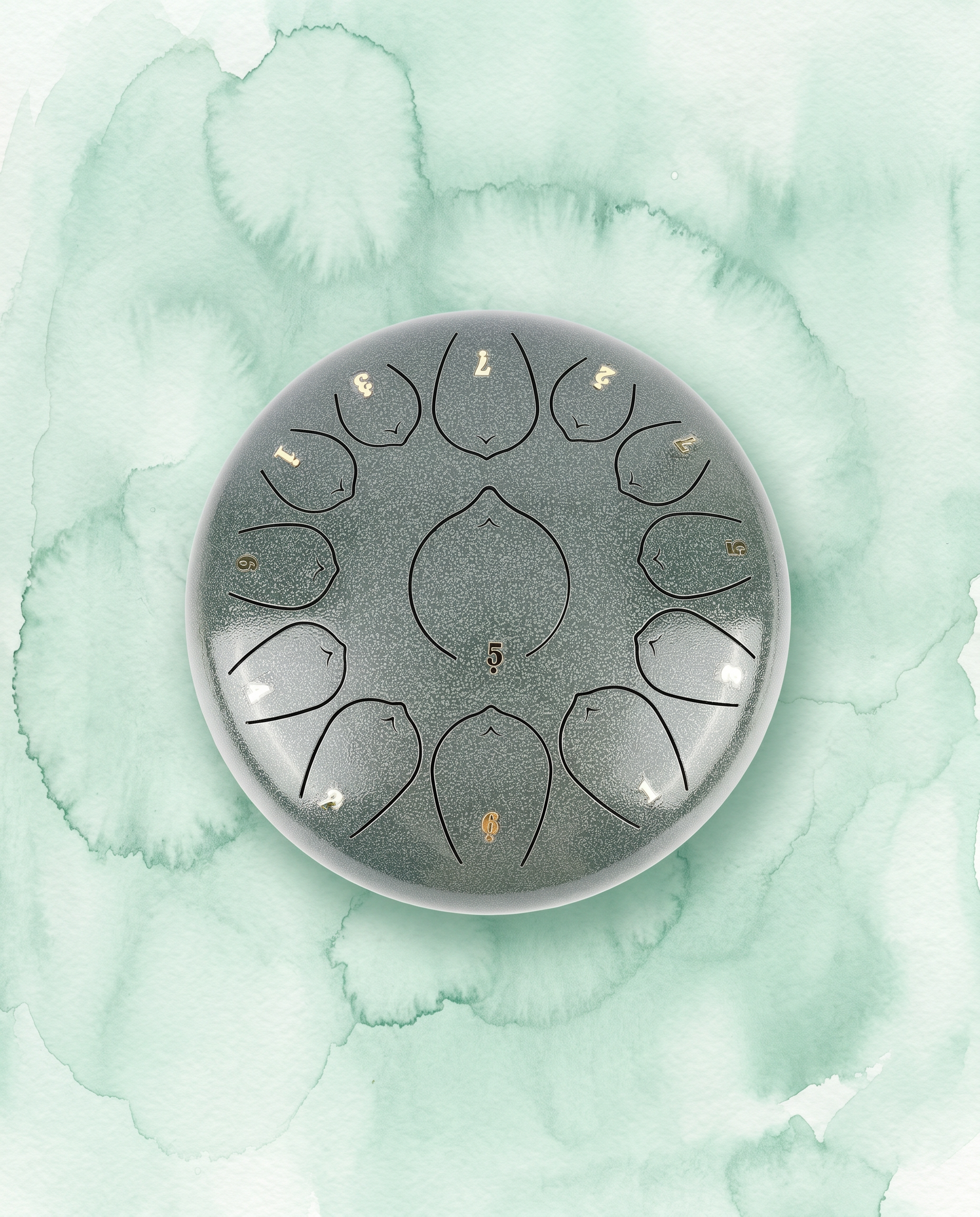 `Jade Celadon Ethereal 12-inch steel tongue drum with numbered notes beneath an ethereal water color sky.
