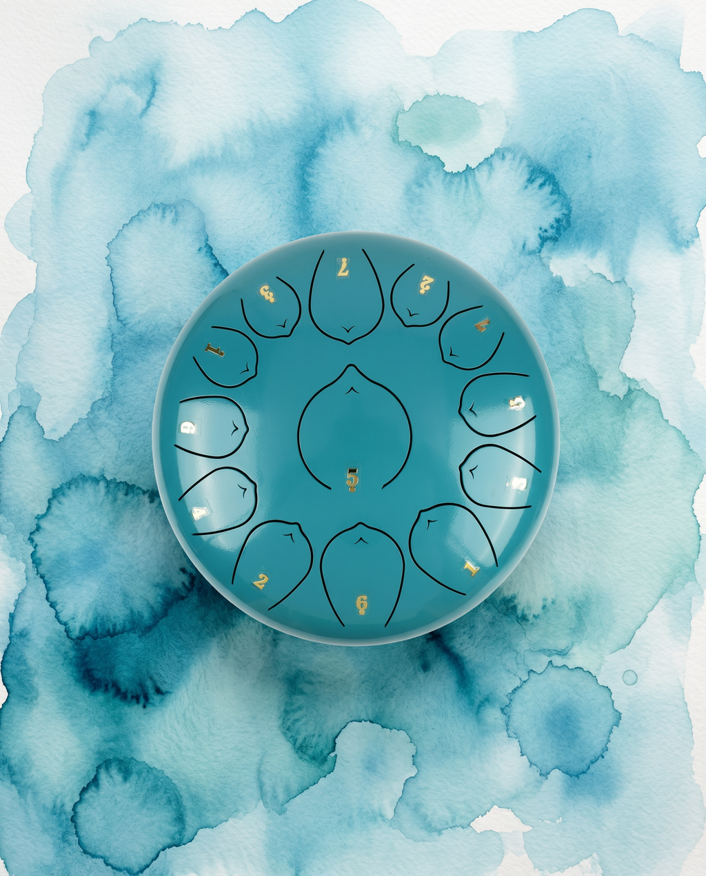 `Lake Blue Ethereal 12-inch steel tongue drum with numbered notes beneath an ethereal water color sky.